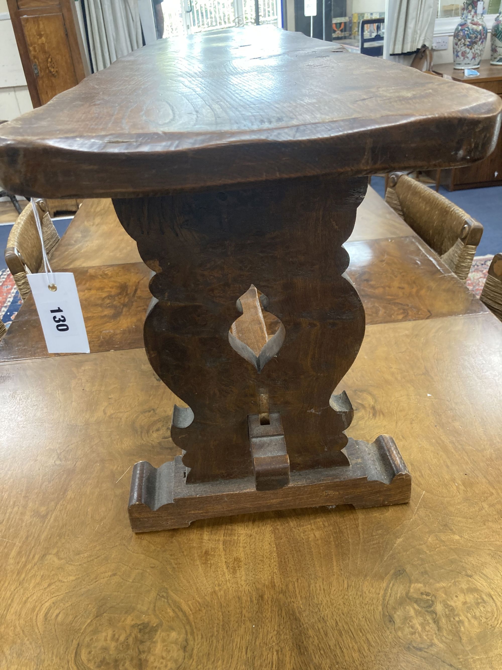 A 17th century style oak bench, length 138cm, depth 29cm, height 44cm